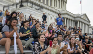 Crowds that attended a sit-in at Capitol Hill listen to Rep. Cori Bush, D-Mo., after it was announced that the Biden administration will enact a targeted nationwide eviction moratorium outside of Capitol Hill in Washington on Tuesday, August 3, 2021. (AP Photo/Amanda Andrade-Rhoades)