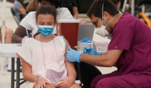 Francesca Anacleto, 12, receives her first Pfizer COVID-19 vaccine shot from nurse Jorge Tase, last week in Miami Beach, Fla. (AP Photo/Marta Lavandier)