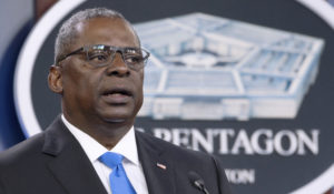 Defense Secretary Lloyd Austin speaks at a press briefing at the Pentagon in Washington in July. Austin issued a memo Monday that says members of the military must be vaccinated against COVID-19 by mid-September. (AP Photo/Kevin Wolf, File)