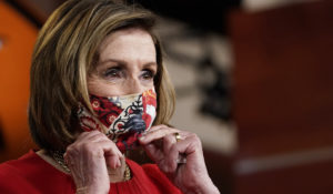 House Speaker Nancy Pelosi of Calif., puts her mask back on after a news conference on Capitol Hill in Washington, Thursday, May 13, 2021. (AP Photo/Susan Walsh)