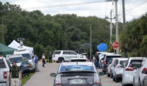 Vehicles from members of the media and curious passersby line a road outside the entrance of the Carlton Reserve during a search for Brian Laundrie, on Tuesday in Venice, Fla. Laundrie is a person of interest in the disappearance of his girlfriend, Gabrielle "Gabby" Petito. (AP Photo/Phelan M. Ebenhack)