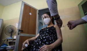 A nurse gives a pregnant woman a shot of a COVID-19 vaccine at a clinic in Havana, Cuba, Thursday, Aug. 5, 2021. (AP Photo/Ramon Espinosa)