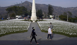 Visitors walk around a memorial for victims of COVID-19 at the Griffith Observatory, Nov. 19, 2021, in Los Angeles.  (AP Photo/Marcio Jose Sanchez, File)