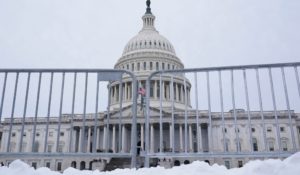 The U.S. Capitol is framed by security barricades in Washington on Wednesday. (AP Photo/Susan Walsh)