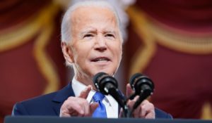 President Joe Biden speaks from the U.S. Capitol on Thursday to mark the one-year anniversary of the Jan. 6 riot . (AP Photo/Andrew Harnik)