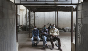 Indian policemen wait to receive the third dose of COVID-19 vaccine at a government hospital in Hyderabad, India, Tuesday, Jan. 11, 2022. India is reporting more than 500 infections of BA.2, a subvariant of omicron. (AP Photo/Mahesh Kumar A.)