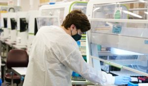 Sonora Quest Laboratory medical laboratory scientists oversee COVID-19 PCR tests at Sonora Quest Laboratories Tuesday, Jan. 11, 2022, in Phoenix. (AP Photo/Ross D. Franklin)