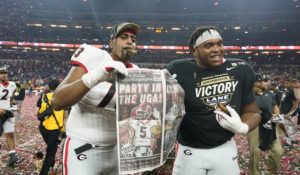 Georgia players celebrate after the College Football Playoff championship football game against Alabama Tuesday, Jan. 11, 2022, in Indianapolis. Georgia won 33-18. (AP Photo/Darron Cummings)