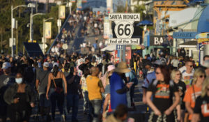 People walk on the pier, Saturday, Feb. 12, 2022, Santa Monica, Calif. (AP Photo/Mike Stewart)