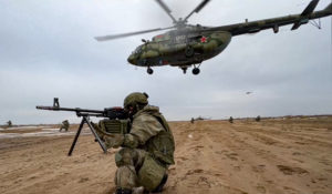 In this photo made from video provided by the Russian Defense Ministry Press Service on Saturday, Feb. 19, 2022, Russian marines take their position during military drills in Belarus. (Russian Defense Ministry Press Service via AP)