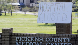 The closed Pickens County Medical Center in Carrollton, Ala., is shown on Thursday, March 26, 2020. The hospital is one of the latest health care facilities to fall victim to a wave of rural hospital shutdowns across the United States in recent years.  (AP Photo/Jay Reeves)