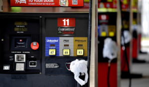 A QuickTrip connivence store has bags on their pumps as the station has no gas, Tuesday, May 11, 2021, in Kennesaw, Ga. Colonial Pipeline, which delivers about 45% of the fuel consumed on the East Coast, halted operations the week prior after revealing a  cyberattack that it said had affected some of its systems. (AP Photo/Mike Stewart)