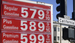 The price board at a gas station is shown next to a California Street sign in San Francisco, Monday, March 7, 2022. The price of regular gasoline broke $4 per gallon (3.8 liters) on average across the U.S. on Sunday for the first time since 2008. (AP Photo/Jeff Chiu)