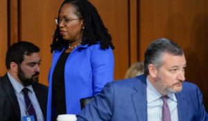 Supreme Court nominee Ketanji Brown Jackson walks by Sen. Ted Cruz, R-Texas, as she returns from a break in her Senate Judiciary Committee confirmation hearing on Wednesday. (AP Photo/Alex Brandon)