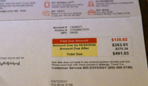 A utility bill that includes late fees from Entergy, in New Orleans. (AP Photo/Matthew Hinton)