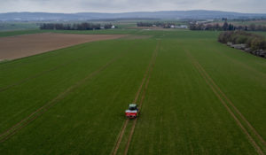A farmer fertilizes a field on the outskirts of Frankfurt, Germany, Monday, April 4, 2022. Russia's war in Ukraine has pushed up fertilizer prices that were already high, made scarce supplies rarer still and squeezed farmers. (AP Photo/Michael Probst)