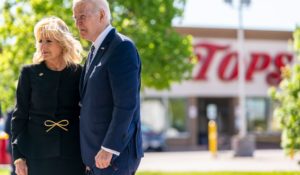 President Joe Biden and first lady Jill Biden pay their respects to the victims of Saturday's shooting at a memorial across the street from the Tops market in Buffalo on Tuesday. (AP Photo/Andrew Harnik)