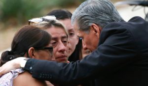 The archbishop of San Antonio, Gustavo Garcia-Siller, comforts families outside the Civic Center following a deadly school shooting at Robb Elementary School in Uvalde, Texas on Tuesday. (AP Photo/Dario Lopez-Mills)