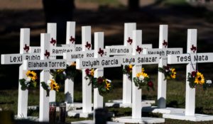 Crosses with the names of Tuesday's shooting victims are placed outside Robb Elementary School in Uvalde, Texas on Thursday. (AP Photo/Jae C. Hong)