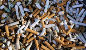 Cigarette butts and residue fill a smoking receptacle outside a federal building on Capitol Hill in Washington, Thursday, April 15, 2021. (AP Photo/J. Scott Applewhite)