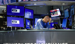 A trader reacts as he works on the floor at the New York Stock Exchange in New York, Monday, June 13, 2022. (AP Photo/Eduardo Munoz Alvarez)