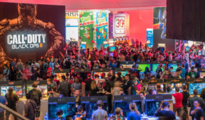 Attendees of the Electronic Entertainment Expo crowd around a booth for "Call of Duty: Black Ops." (Shutterstock)