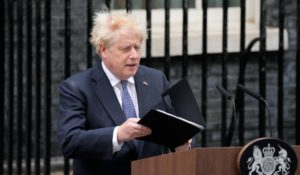 Prime Minister Boris Johnson arrives to read a statement outside 10 Downing Street, formally resigning as Conservative Party leader, in London, on Thursday. (AP Photo/Frank Augstein)