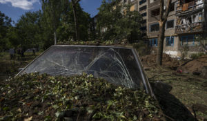 A damaged car in the aftermath of a missile strike in Konstantinovka, in Donetsk Oblast, eastern Ukraine, Friday, July 15, 2022. (AP Photo/Nariman El-Mofty)