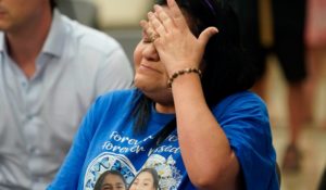 Leticia Cobarrubia, aunt of shooting victims Jackie Cazares and Annabell Rodriguez, wipes away tears as she listens Sunday to the Texas House investigative committee release its full report on the shootings at Robb Elementary School. (AP Photo/Eric Gay)