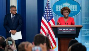 White House press secretary Karine Jean-Pierre speaks about President Joe Biden's positive COVID-19 test during a briefing at the White House on Thursday. White House Covid Response Coordinator Ashish Jha listens at left. (AP Photo/Evan Vucci)