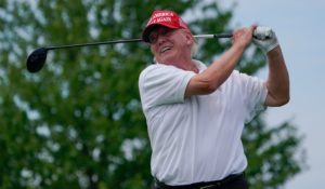 Former President Donald Trump plays during the pro-am round of a LIV Golf tournament in Bedminster, N.J., on Thursday. (AP Photo/Seth Wenig)