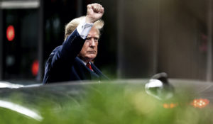 Former President Donald Trump gestures as he departs Trump Tower in New York last week. (AP Photo/Julia Nikhinson)