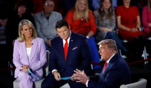 Then-President Donald Trump, right, talking at a Fox News Town Hall with Bret Baier, middle, and Martha MacCallum, left, in March of 2020. (AP Photo/Matt Rourke)