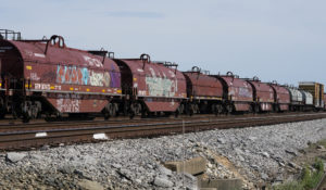 Graffiti-covered Canadian National Railway coil steel cars rest in the Jackson, Miss., terminal rail yard, Wednesday, April 20, 2022. (AP Photo/Rogelio V. Solis)