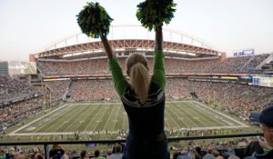 A Seattle Seahawks fan cheers at Lumen Field during the second half of Monday night's Seahawks-Denver Broncos game. (AP Photo/John Froschauer)