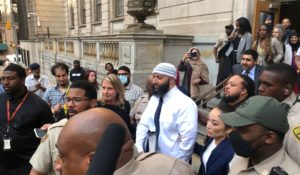 Adnan Syed, center, leaves the Elijah E. Cummings Courthouse in Baltimore on Monday. A judge has ordered the release of Syed after overturning his conviction for a 1999 murder that was chronicled in the hit podcast “Serial.” (AP Photo/Brian Witte)