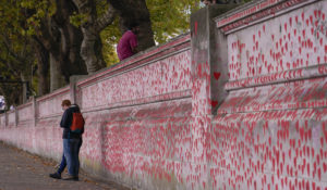 The National Covid Memorial Wall, on the south bank of river Thames, in London, Tuesday, Oct. 4, 2022. (AP Photo/Alberto Pezzali)
