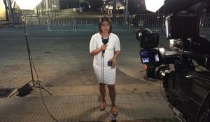 Leslie Rangel in 2016, reporting on former President Barack Obama's arrival at the AT&T Performing Arts Center in Dallas for a memorial service honoring the Dallas police officers killed in a mass shooting that July. (Courtesy: Leslie Rangel)
