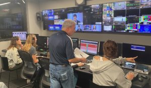 Steve Kraycik, a professor and director of student television at Penn State, coordinates a newscast run by students. (Photo by Barbara Allen)