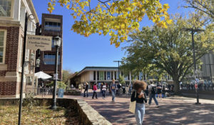 Students walk through the quad outside the student union at the University of North Carolina at Chapel Hill on Oct. 24. (AP Photo/Hannah Schoenbaum)