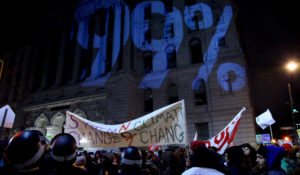 A light projection is cast on a building during a Nov. 17, 2011, Occupy Wall Street protest in New York City. (AP/Craig Ruttle)