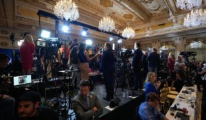 Members of the media report from Mar-a-Lago, where Donald Trump announced his presidential run on Tuesday. (AP Photo/Rebecca Blackwell)