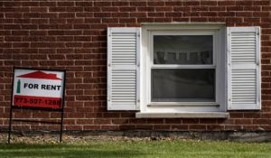 A "for rent" sign is displayed outside apartment in Mount Prospect, Ill.,  in October 2020. (AP Photo/Nam Y. Huh)