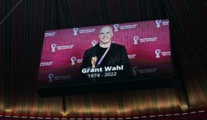 A tribute to journalist Grant Wahl is shown on a screen before the World Cup quarterfinal soccer match between England and France in Qatar on Saturday. (AP Photo/Abbie Parr)