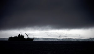In this Jan. 25, 2015 file photo, Chile's Navy ship Aquiles moves alongside the Hurd Peninsula, seen from Livingston Islands, part of the South Shetland Islands archipelago in Antarctica. Antarctica’s ozone hole is finally starting to heal, a new study finds. (AP Photo/Natacha Pisarenko, File)