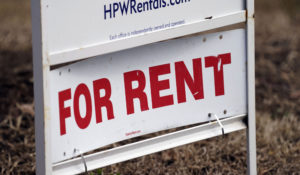 A for rent sign is displayed along a neighborhood street in Mebane, N.C., Wednesday, Feb. 10, 2021. (AP Photo/Gerry Broome)