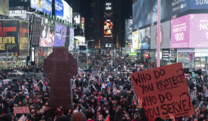 Demonstrators gather during a protest in Times Square on Saturday, Jan. 28, 2023, in New York, in response to the death of Tyre Nichols, who died after being beaten by Memphis police during a traffic stop. (AP Photo/Yuki Iwamura)