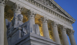 Light illuminates part of the Supreme Court building on Capitol Hill in Washington, Wednesday, Nov. 16, 2022. (AP Photo/Patrick Semansky)