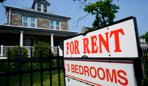 A sign indicating the availability of a home to rent stands outside a building in Philadelphia, Wednesday, June 22, 2022. (AP Photo/Matt Rourke, File)