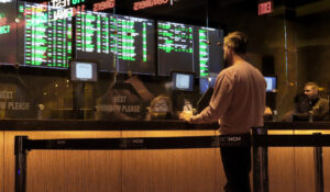 A customer makes a sports bet at the Borgata casino in Atlantic City N.J. on March 17, 2022 just before the March Madness college basketball tournament began. (AP Photo/Wayne Parry)